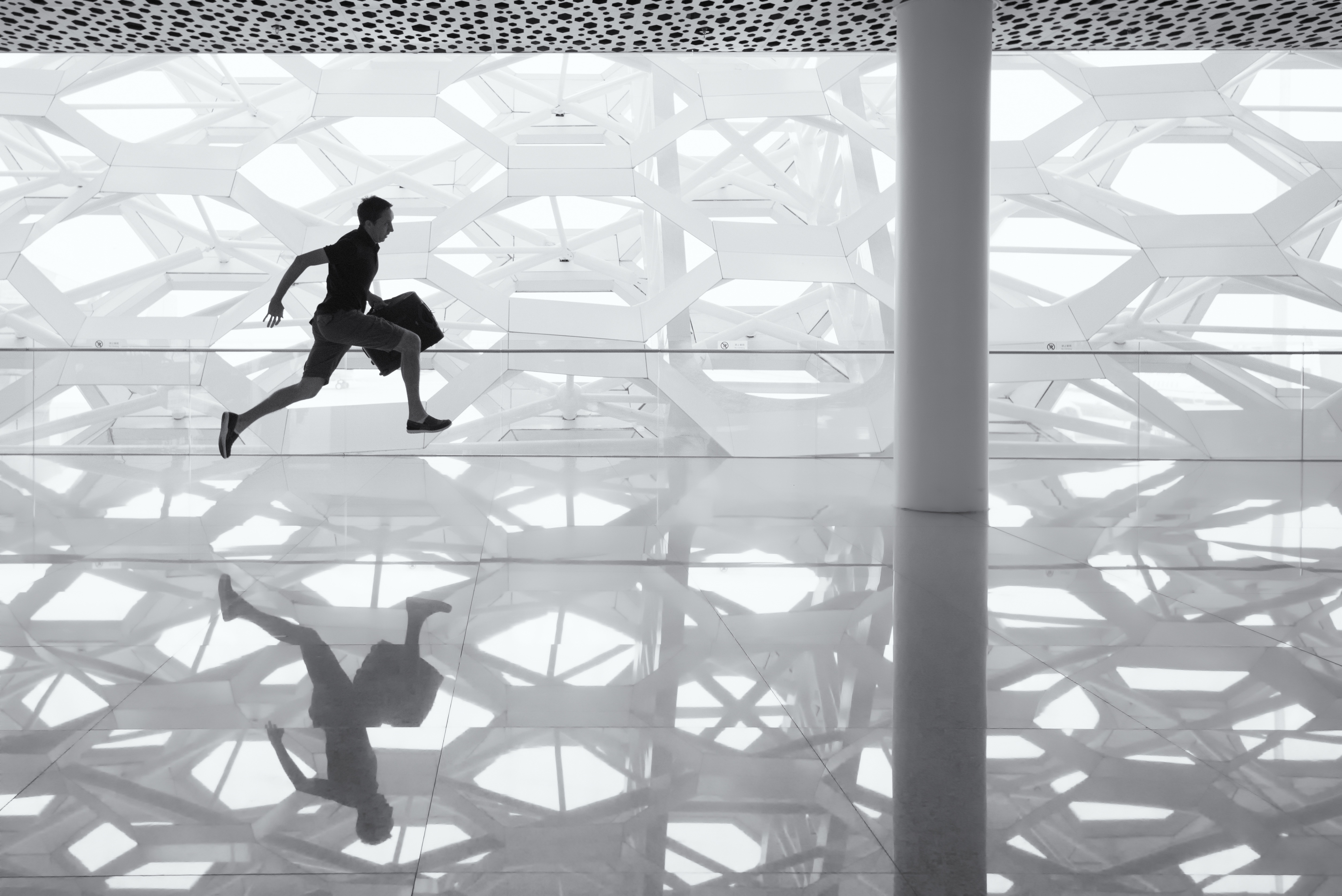 man running through the office hall